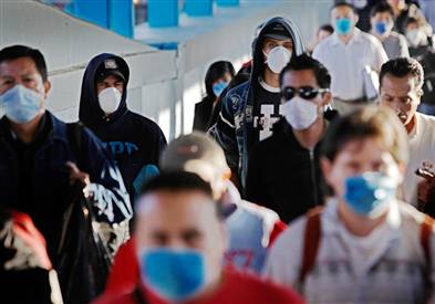 an image of people walking down the street with flu masks
